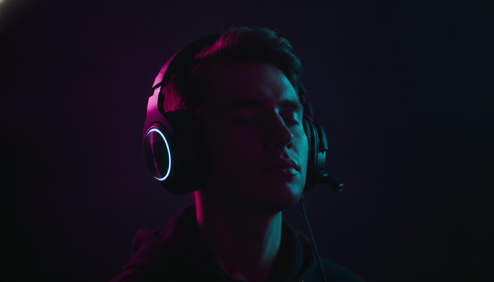 Calm gamer silhouette taking a deep breath in neon light