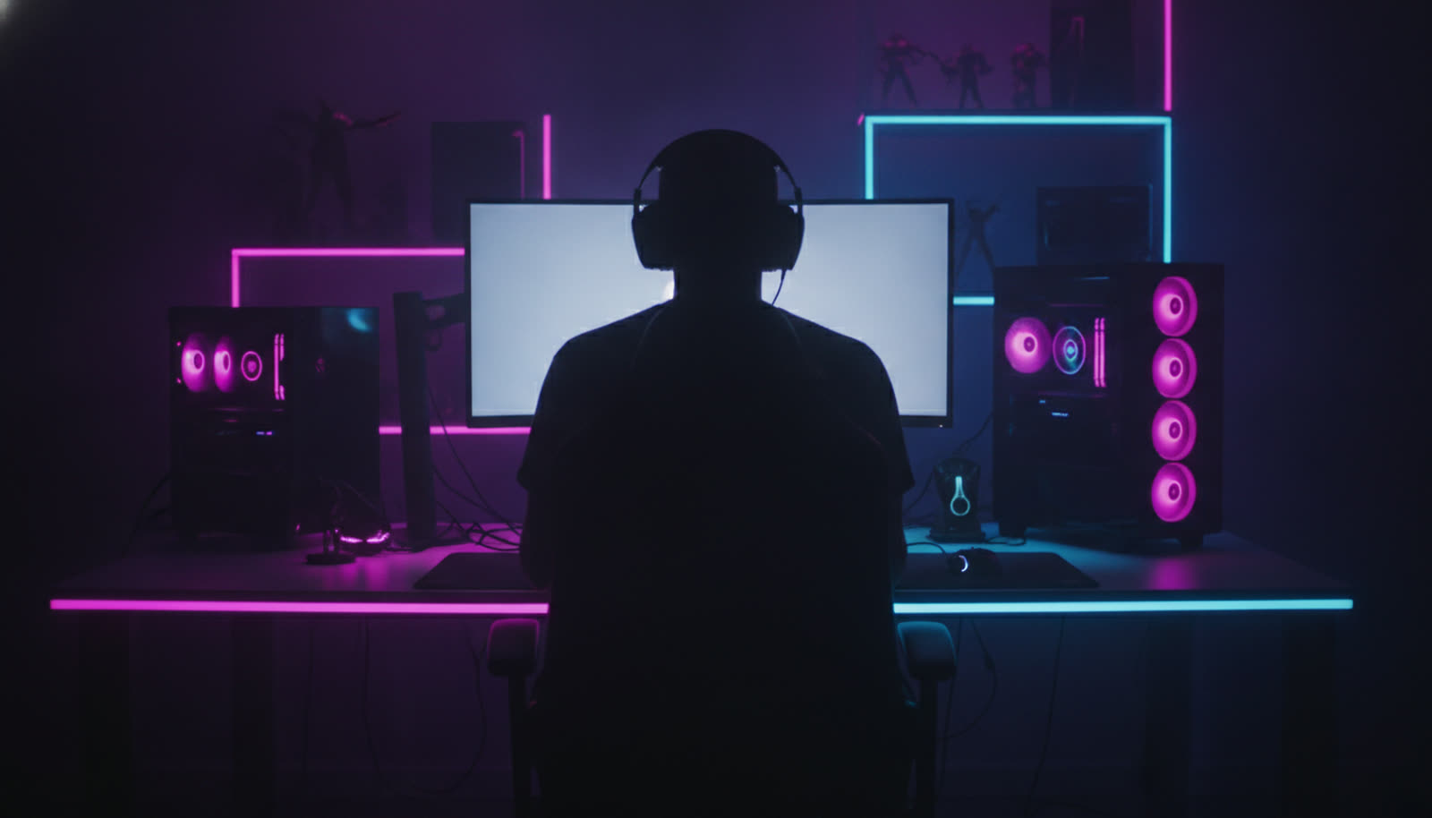 Gamer at a glowing battlestation grinding late at night
